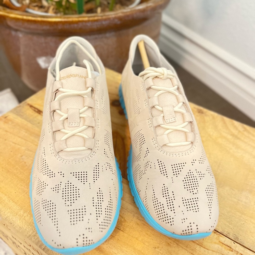 Cole Haan zerogrand perforated  trainer beige in color size 7B